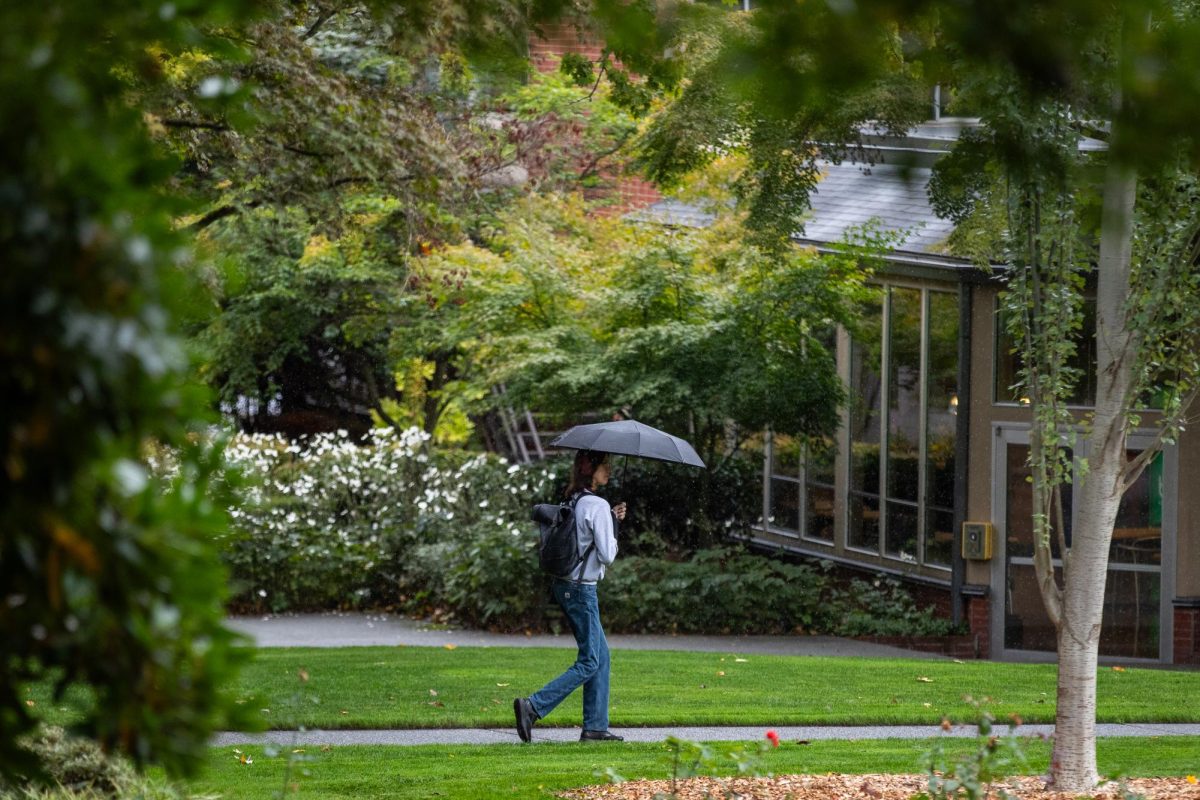 A student makes their way to class in the rain on Tuesday, Oct. 10, 2023, in Seattle. Despite the rainy weather Seattle is still in a water shortage.
