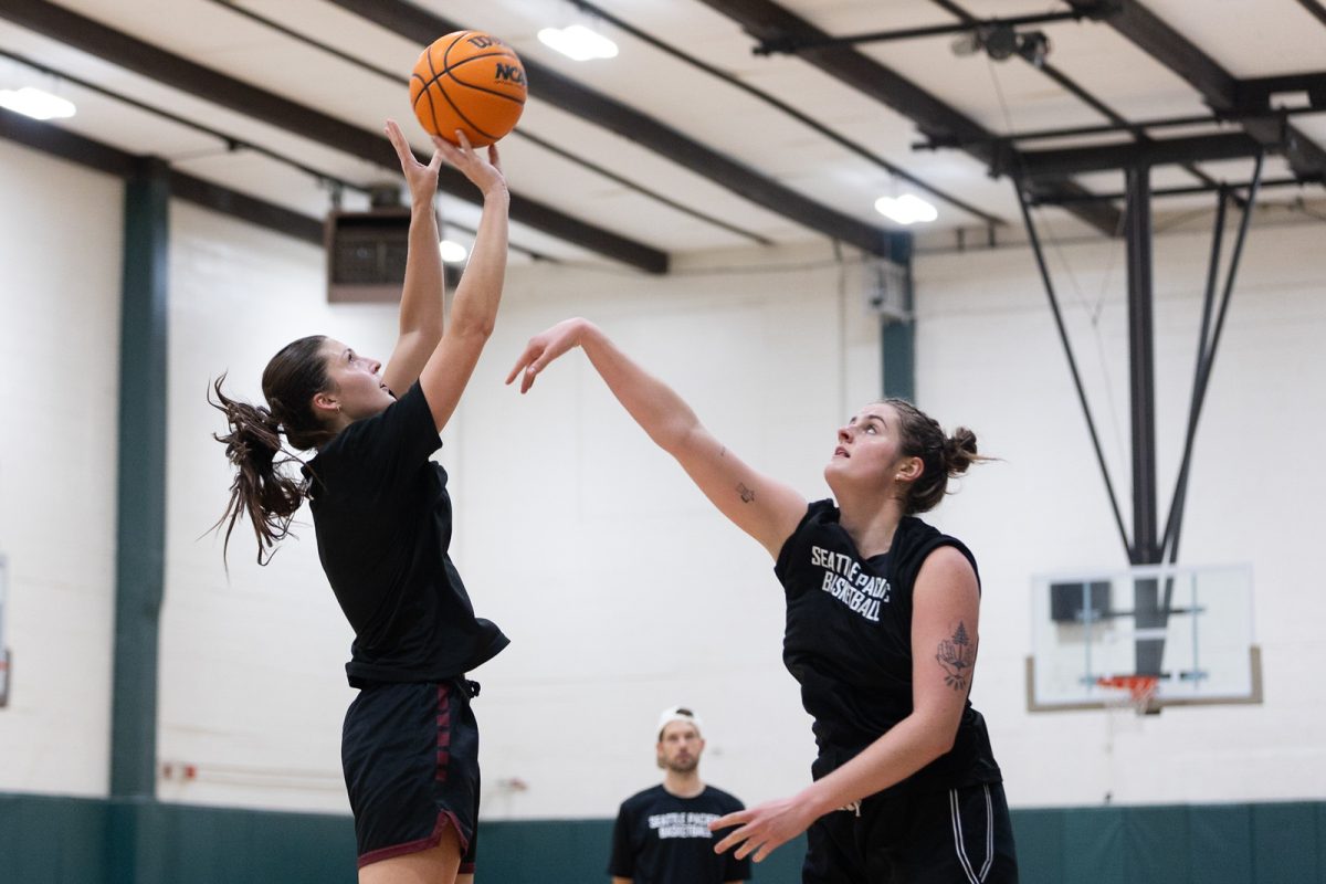 Seattle Pacific University Womens Basketball center Schuyler Berry, right, goes up for a block on Forward Olivia Mayer, left, during practice on Friday, Sept. 29, 2023 in Seattle. File photo.