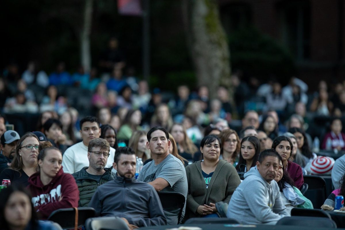Families of the 2024 incoming class sit at the new student convocation in Tiffany Loop on Friday, Sept. 8, 2023 in Seattle. The incoming class was forty-two percent first generation. 