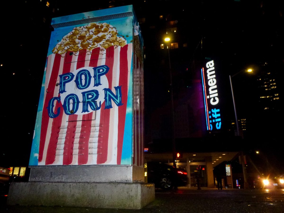The electrical box across the street from the SIFF Cinerama displays the theaters famous chocolate popcorn on Thursday, Jan. 25, 2024, in Seattle.