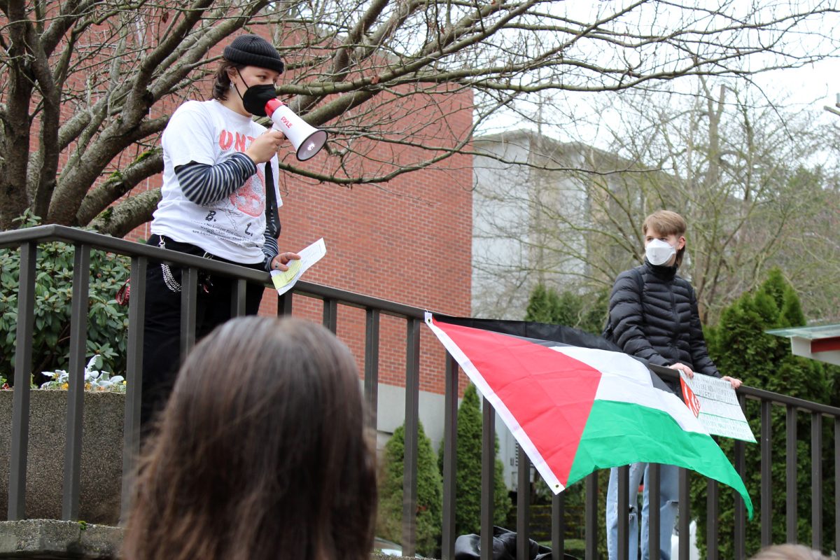 Rae Perez speaks at a demonstration in front of Demaray Hall on Thursday, Jan. 25, 2024, in Seattle