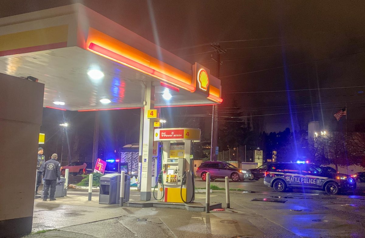 Seattle Police Department vehicles are parked Nickerson Street as SPD responded to an armed robbery at the Shell gas station across from he art center on Wednesday, Jan. 3, 2023. The robbery occurred around 5:20 p.m. before the robbers fled away from the Seattle Pacific University campus.