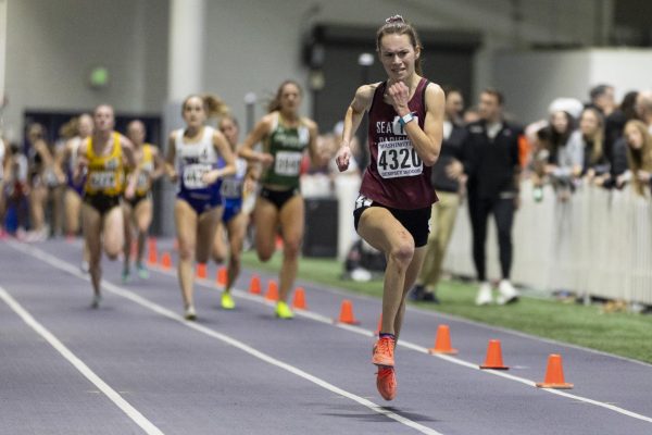 Seattle Pacific University distance runner Annika Esvelt sprints to the finish line at the end of her 5,000 meter heat at The Dempsey Indoor track on Feb. 9, 2024, in Seattle. 
