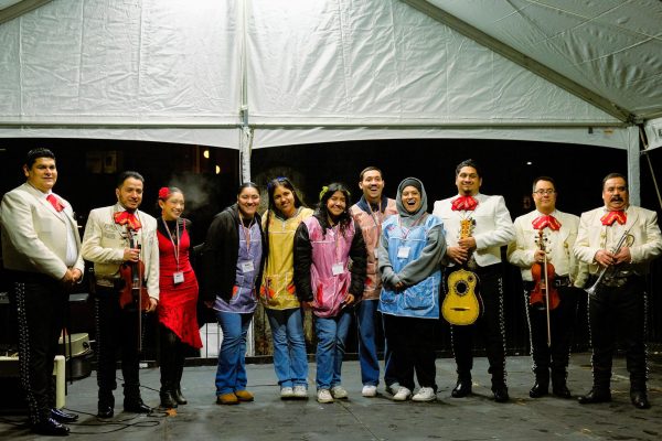 Members of MEChA pose for a photo with Mariachi de Seattle during the Hello Festival in Tiffany Loop on Thursday, Feb.15, 2024, in Seattle.