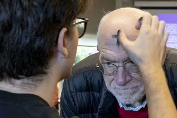 Communication Professor Dr. William Purcell receives a cross of ashes on his forehead during an Ash Wednesday Service in Upper Gwinn on Feb. 14, 2024, in Seattle.