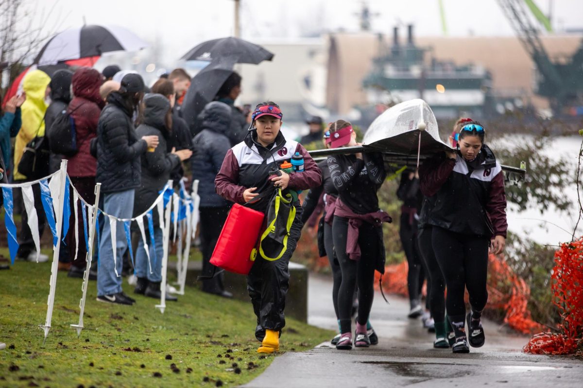 Sophomore coxswain Lexi Roybal leads sophomore Gem Gatmaytan and the rest of the Seattle Pacific University Varsity 8+ back to the shell house after competing in the first flight of the Falcon Regatta on Saturday, Mar. 23, 2024, in Seattle.