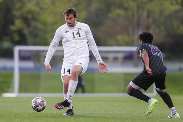 Seattle Pacific Mens soccer midfielder Jack Goode controls the ball during a spring game against the University of Washington on Saturday, April 20, 2024, in Seattle.