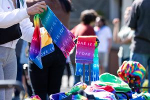 A student grabs a pride scarf during an event on April 14, 2023, in Seattle.