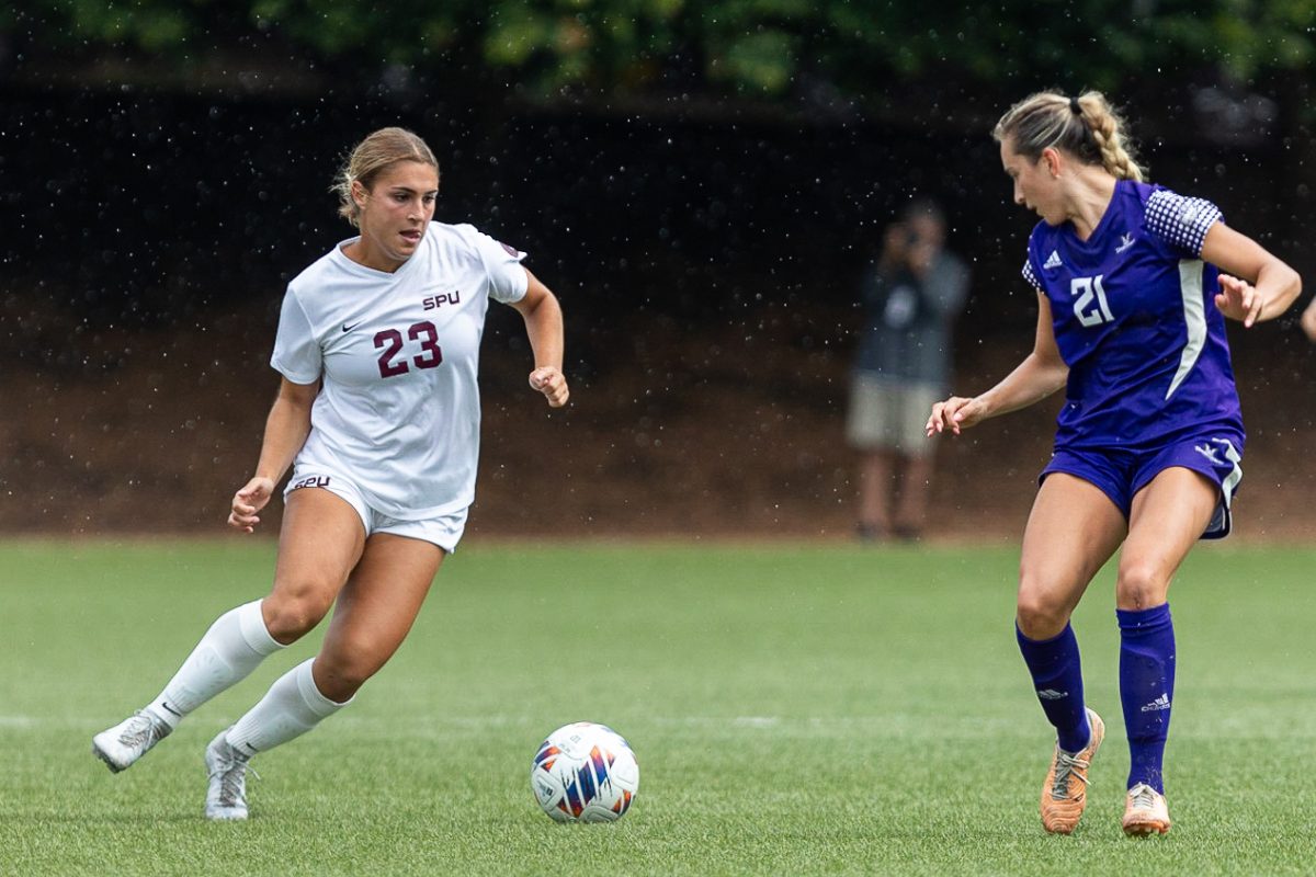 Seattle Pacific University forward Taylor Krueger (23) takes on a Westminster defender during a non-conference game at Interbay stadium on Aug. 31, 2023, in Seattle.