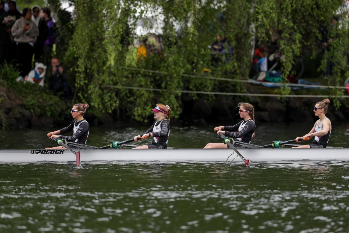 Members of the SPU Open 8+ compete during the opening day regatta on the Montlake Cut on Saturday, May 4, 2024, in Seattle.