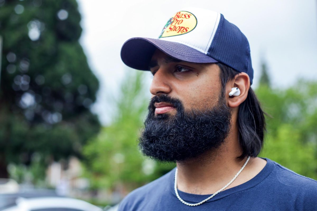 Gurv Basra poses for a portrait while listening to music on Wednesday, May 29, 2024, in Seattle.