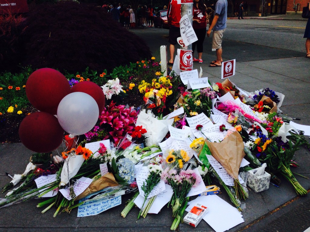 Flowers and notes left by friends for Paul Lee, the SPU student who lost his life during a campus shooting on June 5, 2014.