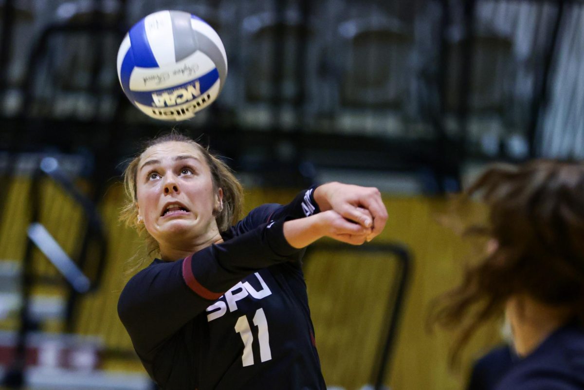 Seattle Pacific University outside hitter Anna Pelluer (11) passes during a match against the University of Alaska Anchorage, Saturday, Oct. 5, 2024, in Seattle.