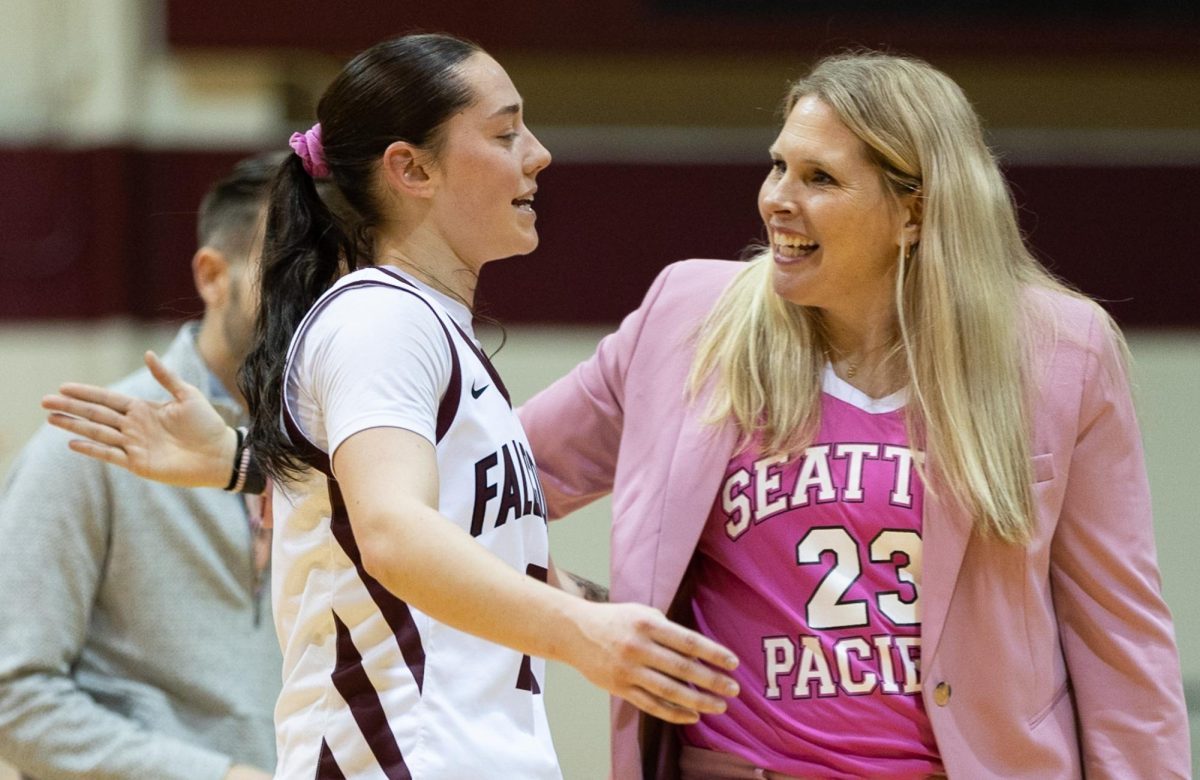 FILE: Seattle Pacific University guard Lolo Weatherspoon (10) is embraced by coach Karen Byers after a game against Central Washington on Feb. 1, 2024, in Seattle.