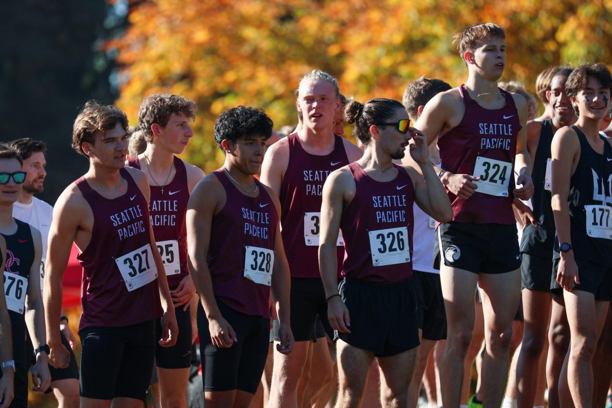 SPU men's cross country lines up at the starting line.