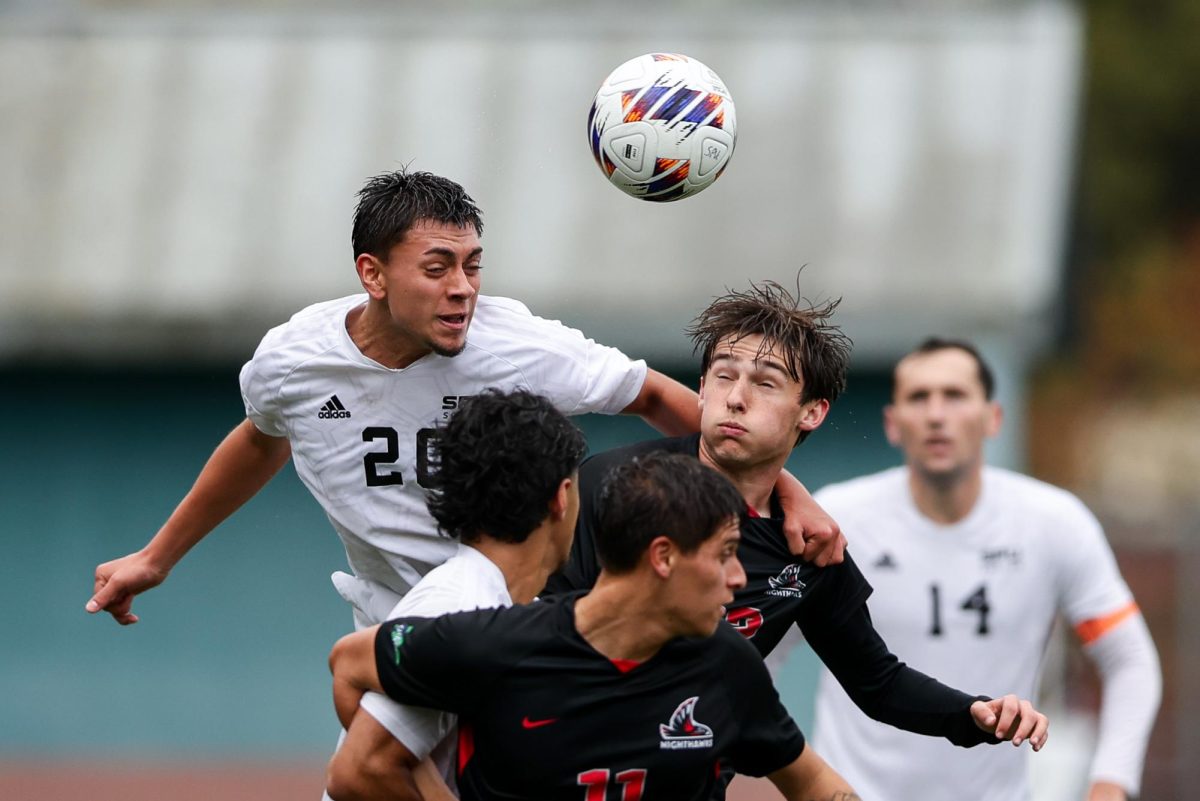 Seattle Pacific defender Alexander Magana (20) wins a header over a Northwest Nazarene defender during the second half of a game on Saturday, Oct. 26, 2024, in Seattle.