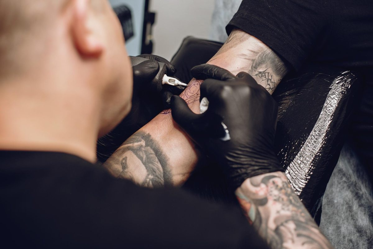 Man doing tattoo