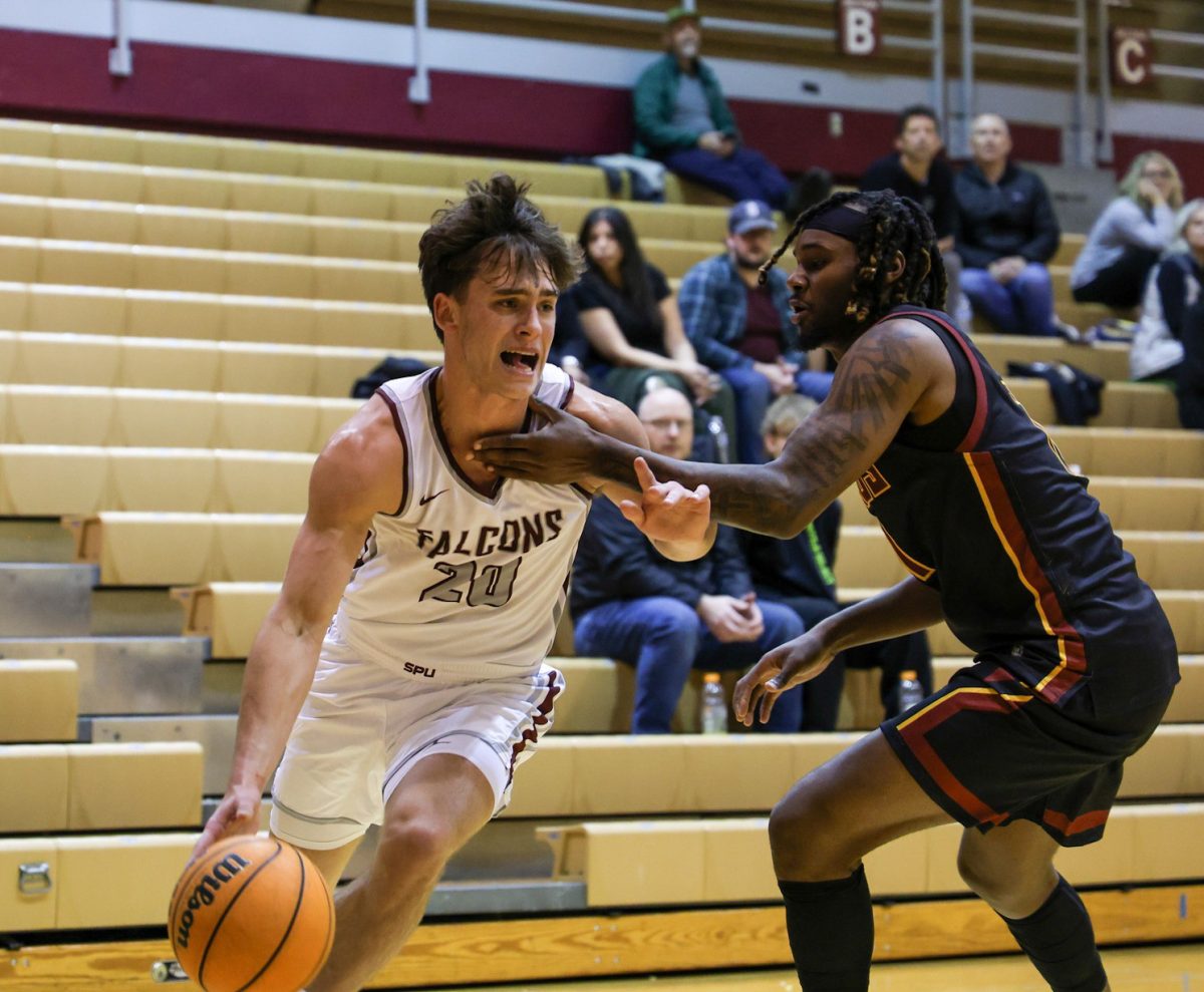 First year Henry Sandberg (20) blocks the ball from Cal State Dominguez Hills on Nov. 14, 2024 in Seattle.