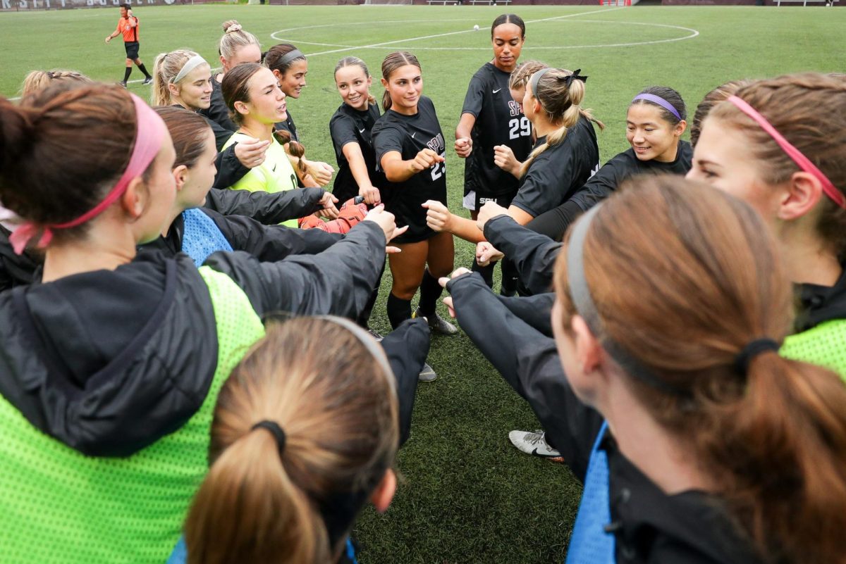 The SPU women's soccer team celebrates together at the Senior Night game on Oct. 31, 2024, in Seattle.