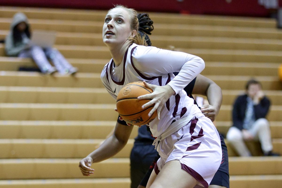 Senior Emilia Bishop (15) guards the ball against Western Oregon University on Jan. 11, 2025 in Seattle.