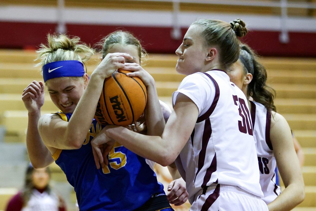 Third-year Madison Rubino (30) aims to snatch the ball away from Alaska Fairbanks on Jan. 25, 2025 in Seattle.