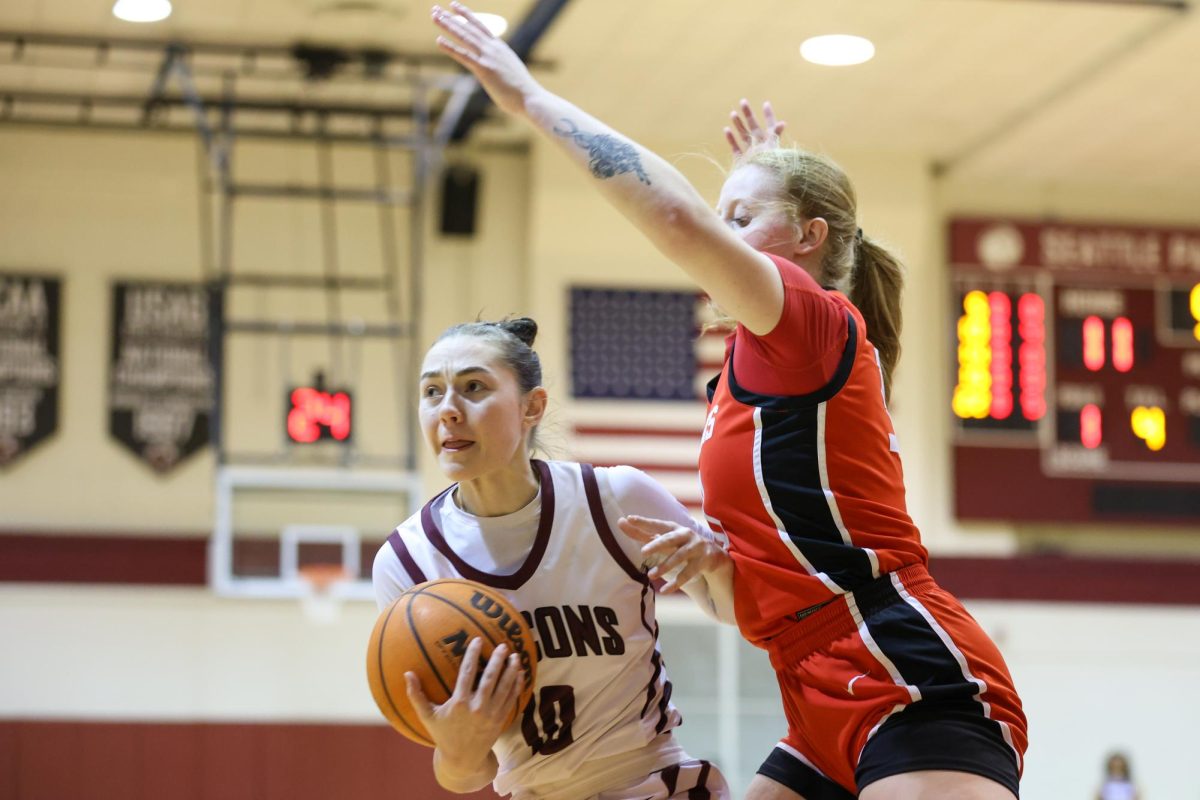 Senior Lolo Weatherspoon (10) guards the basketball while playing against Northern Nazarene University on Feb. 13, 2025.