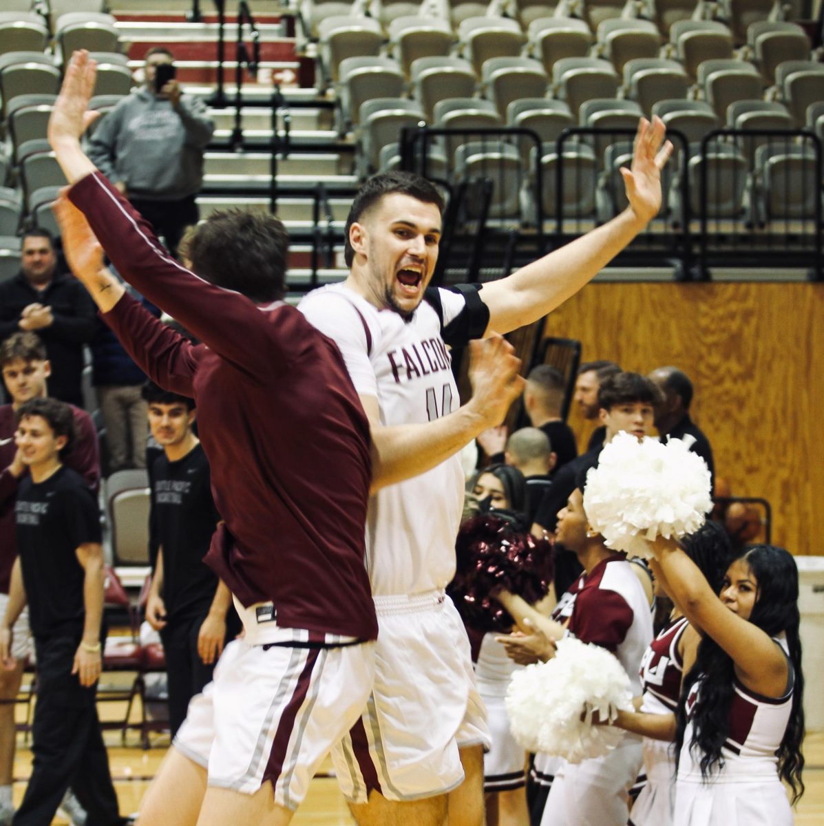 SPU Senior Bryan Caldera (15) and Junior Trace Evans (14) making their entrance into the game against Northwest Nazarene on Feb. 13, 2025.