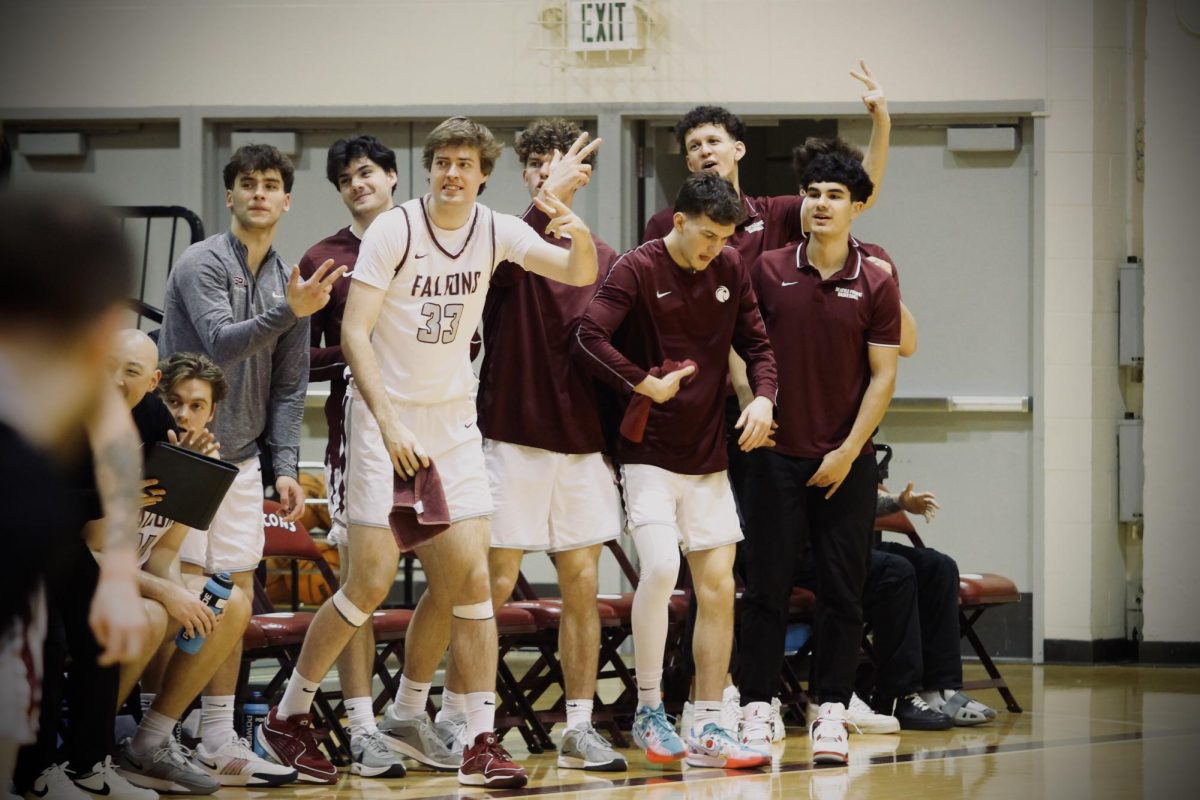 SPU team celebrating a 3-pointer made by R-Sophmore Jonas La Tour (4) against Saint Martin's on Feb. 1st, 2025.