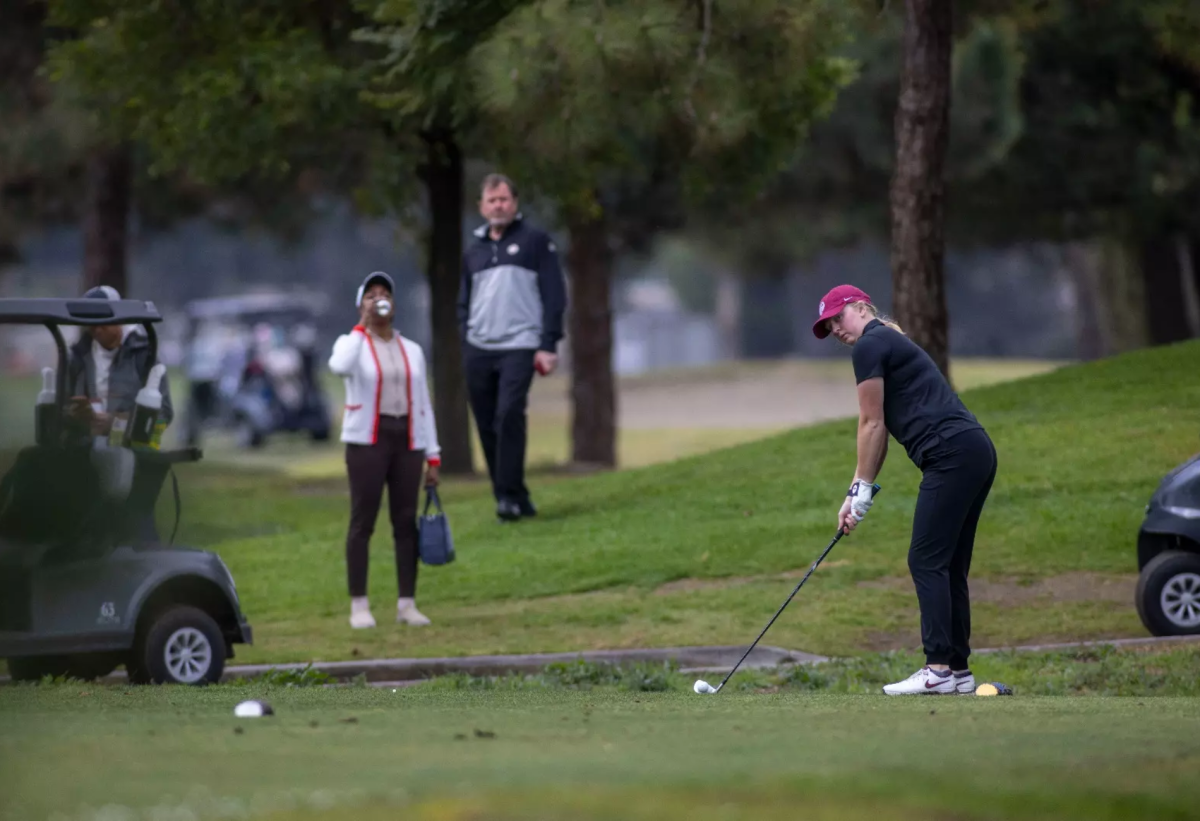 Seattle Pacific University golfer Zoe Garcia sets up for a shot at the SMSU Classic in Phoenix, Arizona. (Courtesy of SPU Athletics)