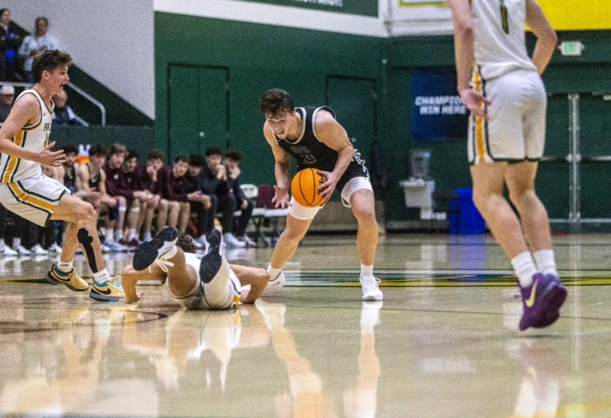 Seattle Pacific men's basketball junior guard Jaxon Nap (3) runs the ball against three Point Loma players in the NCAA West Regionals Tournament on Friday, Mar 14, 2025, in San Diego, California. (Courtesy of SPU Athletics)