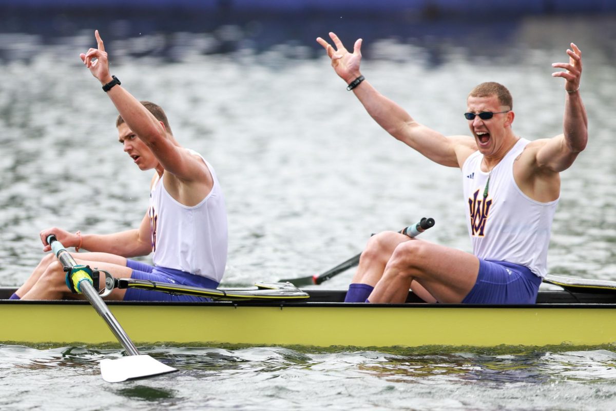 Sam Ford (left) and Logan Ullrich (right) from the University of Washington men's varsity eight react after winning the Windermere Cup, Saturday, May 3, 2025, in Seattle.