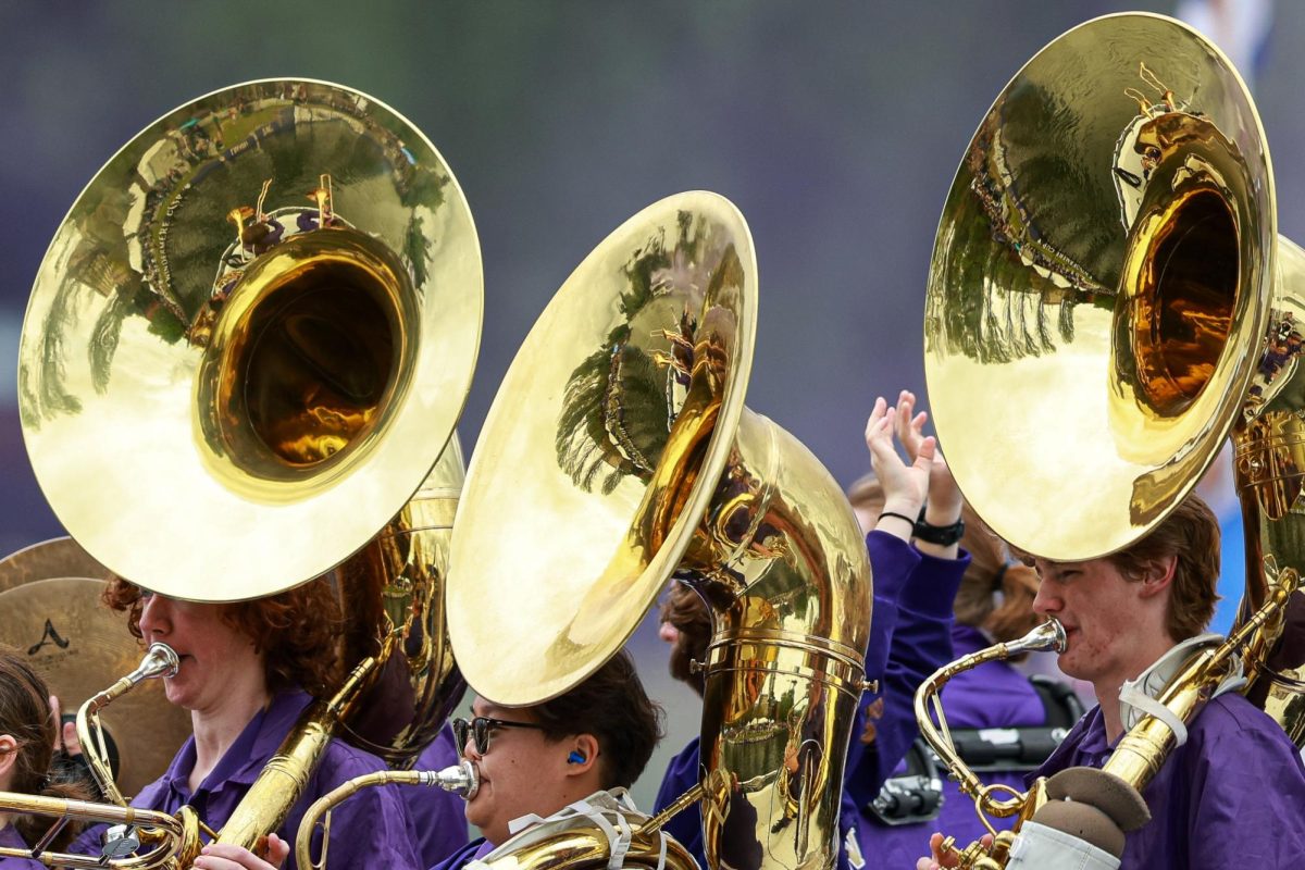 Members of the Husky band perform during the Opening Day Boat Parade after the Windermere Cup Regatta, Saturday, May 3, 2025, in Seattle.
