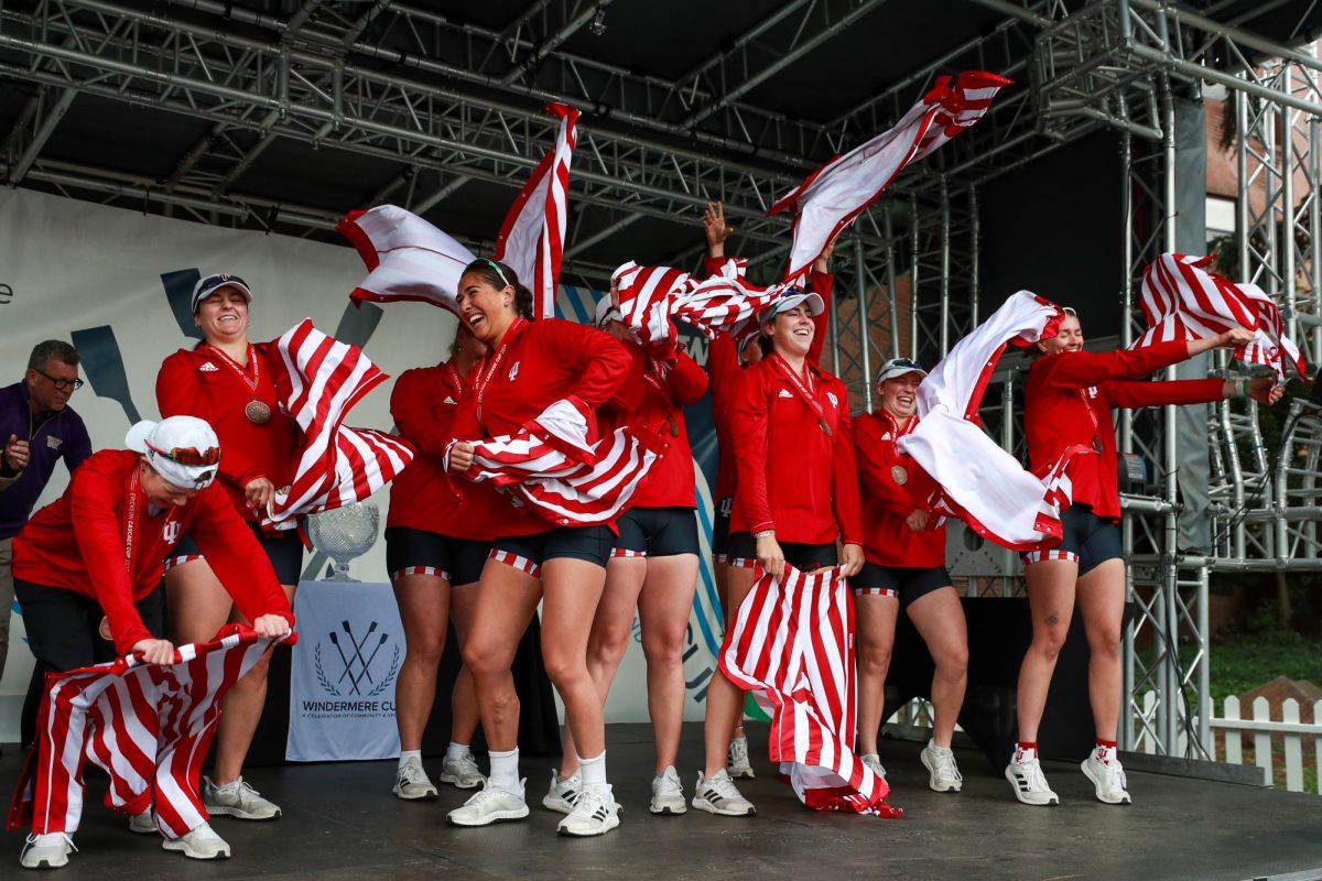 The Indiana rowing team smiles after ripping off their tear-away pants during the awards ceremony for the Windermere Cup, Saturday, May 3, 2025, in Seattle.