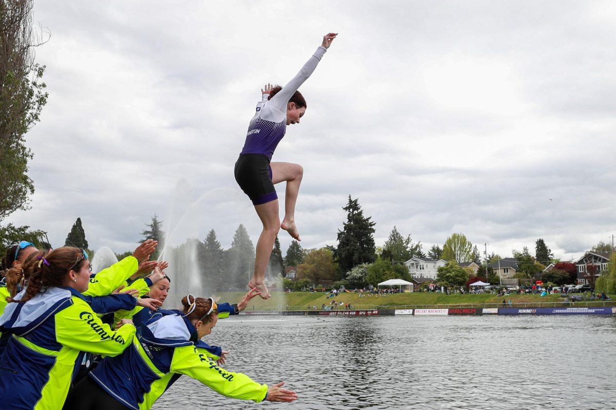 The University of Washington women's varsity eight throws coxswain Isabel Michaelson into the cut after winning the Windermere Cup, Saturday, May 3, 2025, in Seattle.