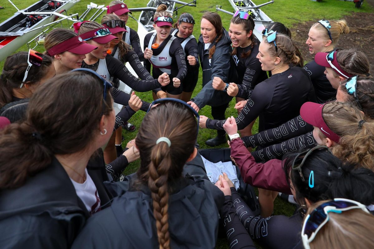 The Seattle Pacific University rowing team cheers before taking the water for the Windermere Cup, Saturday, May 3, 2025, in Seattle.
