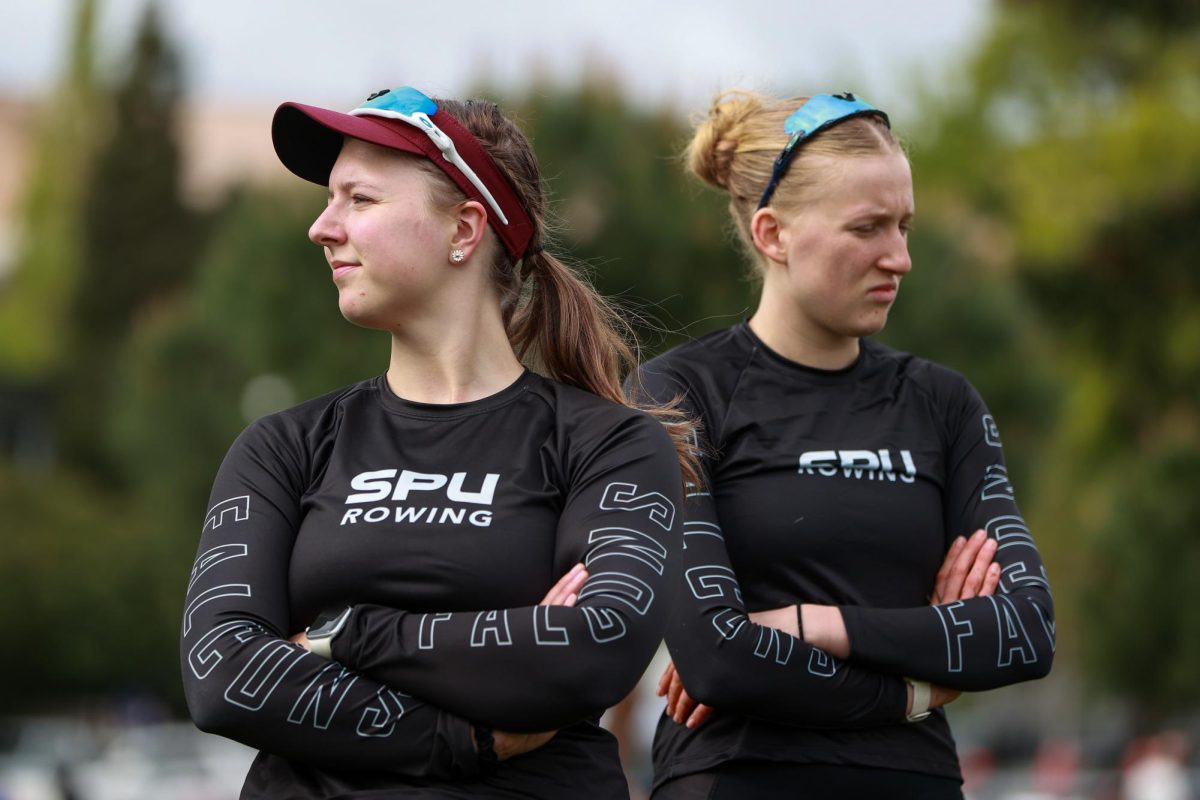 Megan Rouse (left) and Solanes Capps-Mace (right) look on before the races on Saturday, May 3, 2025, in Seattle.