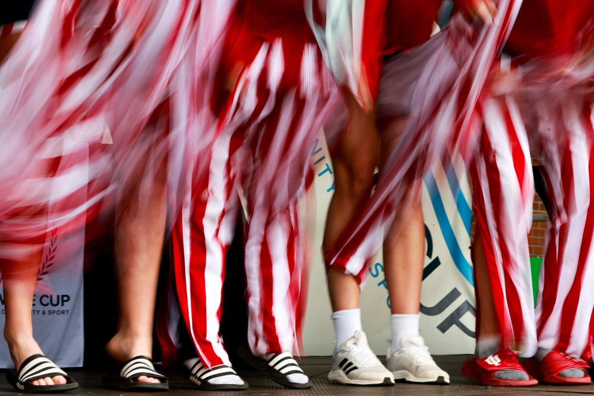 The University of Indiana rowing team rips off their tear-away pants during the award ceremony for the Windermere Cup, Saturday, May 3, 2025, in Seattle.